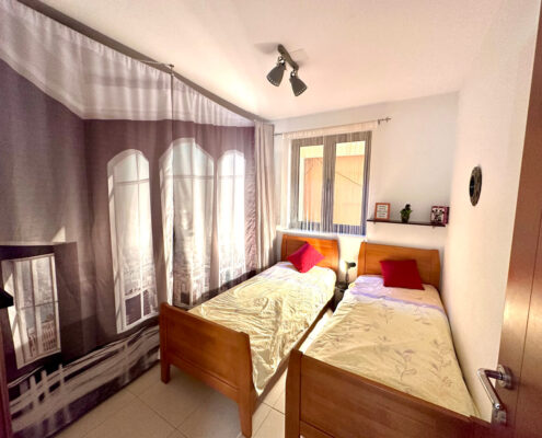 second bedroom with enough storage and two single beds, that can be pushed together